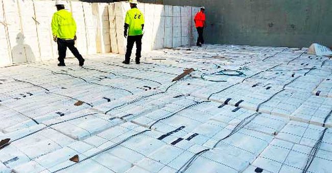 AMCI surveyors at work in a cargo hold